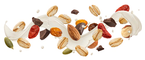 Preview: Falling muesli with milk splash isolated on white background