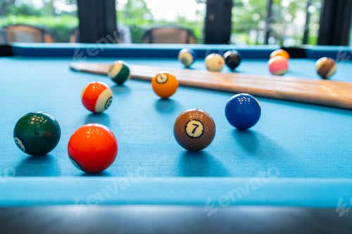 Preview: Close-up Billiard Balls on Blue Felt Table