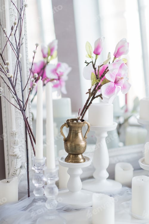 Preview: Shabby chic home design. Beautiful decoration table with a candles, flowers in front of a mirror
