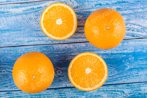 Preview: Freshly Squeezed Citrus Juice. Oranges Fruit And Orange Juice On A Blue Wooden Background. Place