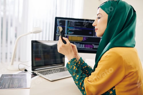 Preview: Software developer checking phone