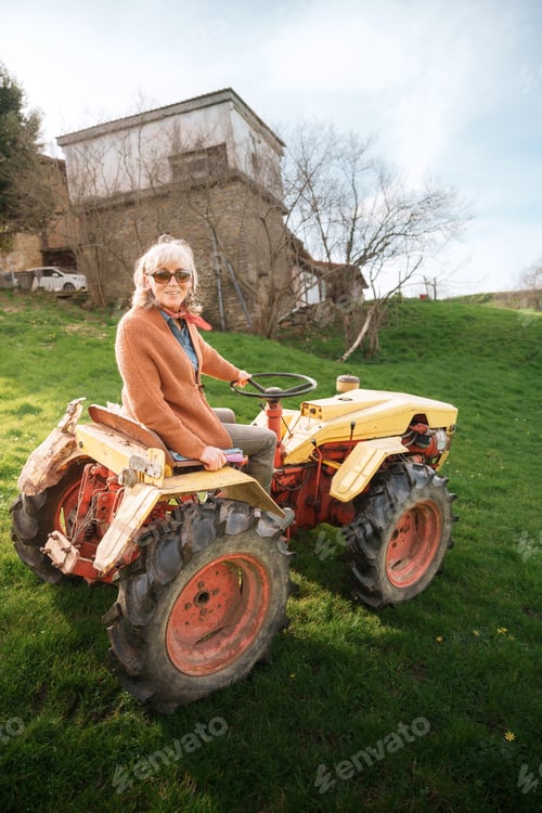 Preview: Woman on Tractor Outdoors in Rural Setting