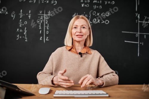 Preview: Professional teacher having online lesson in class