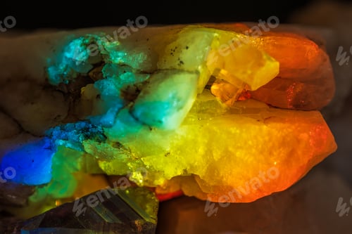Preview: natural quarts rock with embedded crystal in prism light