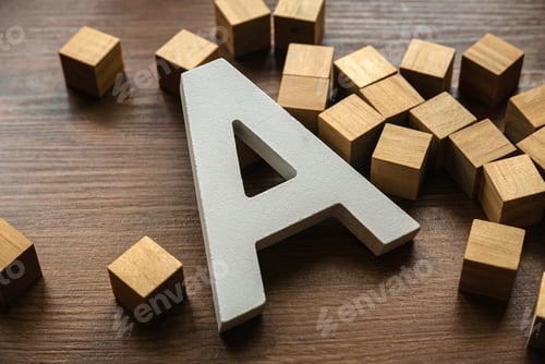 Preview: Wooden letter A on a brown wooden background.