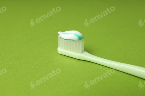 Preview: Concept of tooth care on green background