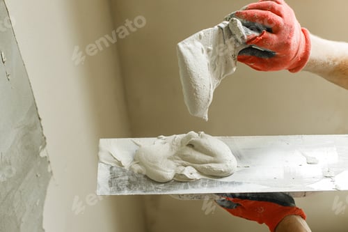 Preview: Handyman plastering walls with gypsum plaster and trowel