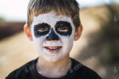 Preview: Portrait of a cute little boy with painted face for Halloween