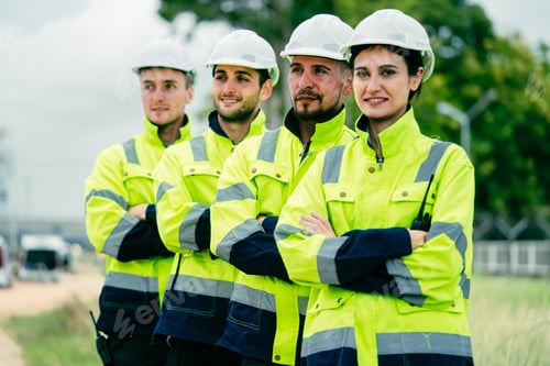 Preview: Engineer worker in arms crossed standing in a row smile to camera with petroleumchemical industry