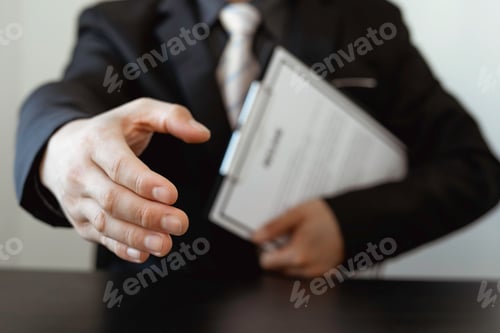 Preview: Greeting new colleagues, Handshake while job interviewing, male candidate shaking hands with Intervi