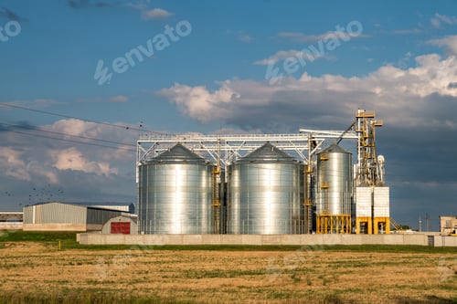 Preview: silver silos on agro manufacturing plant for processing drying cleaning and storage