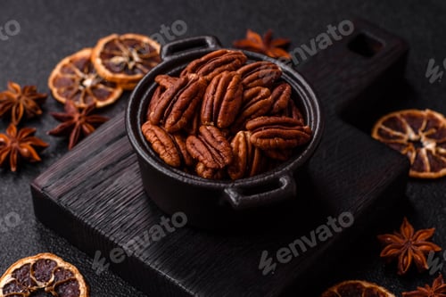Preview: Peeled and roasted pecan nut as an ingredient for healthy food. Pecan nut as a food background