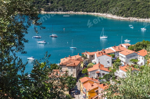 Preview: Seaside town of Rabac in Croatia with red-roof buildings and ships in the sea