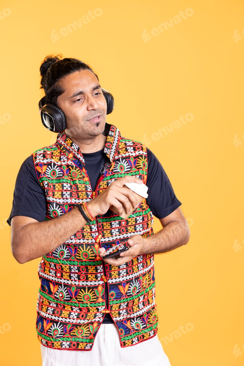 Preview: Joyous man enjoying fresh coffee, chatting with mates, listening music