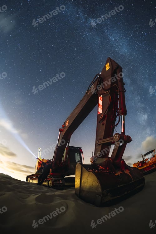 Preview: Excavator working under the night sky with the milky way in Valdevaqueros, Cadiz, Andalucia