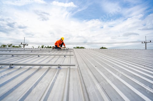 Preview: skilled technician adjusts a solar panel on rooftop