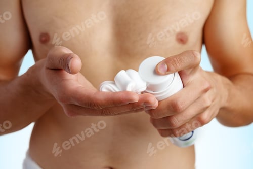 Preview: Unrecognizable man holding shaving foam in hands against white background