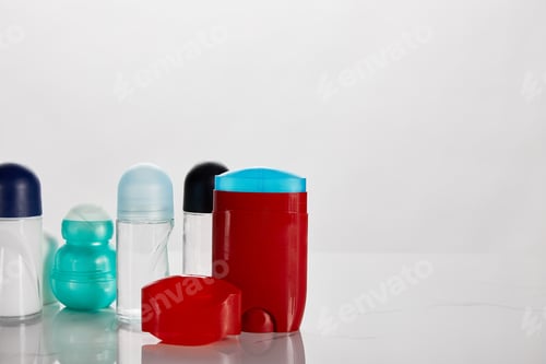 Preview: colorful bottles of roller deodorant isolated on white