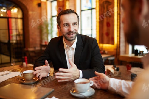 Preview: Business People Enjoying Coffee Break in Restaurant