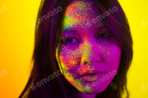 Preview: Fashion model with fluo painting on the face