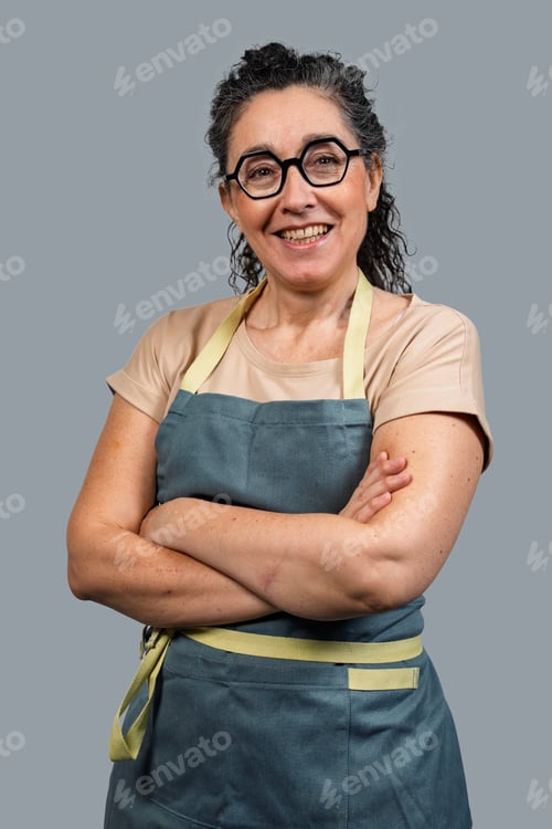 Preview: Smiling woman small business owner wearing apron