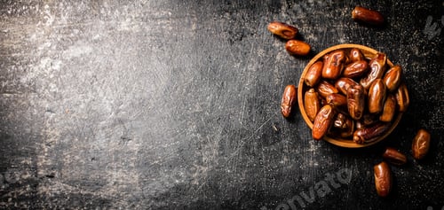 Preview: Ripe dates on a plate on the table.