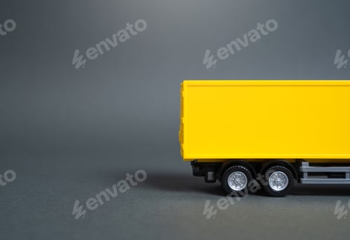 Preview: Yellow truck side view. Empty yellow background. Concept of transportation,