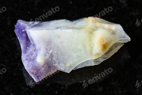 Preview: sample of raw opal mineral on black granite