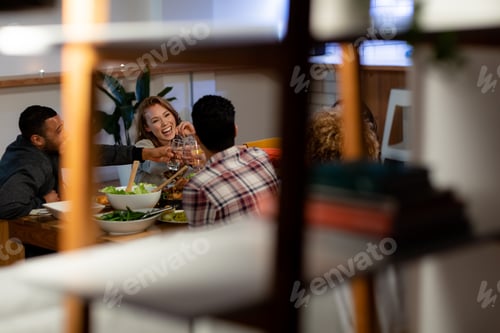 Preview: Millennial adult friends celebrating Thanksgiving together at home