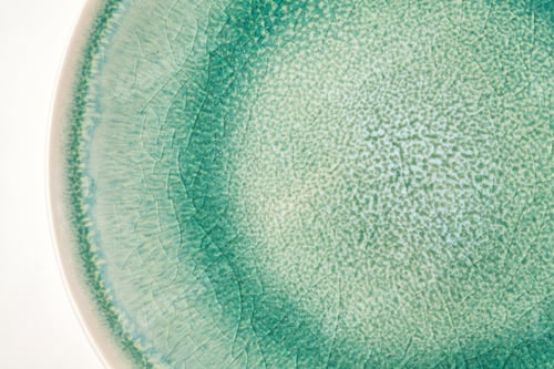Preview: Close up shot of green porcelain texture of the plate