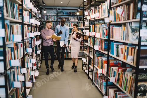 Preview: Group of multiracial students walking in library