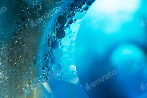 Preview: Oil bubbles close up. circles of water macro. abstract light blue background