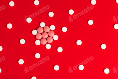 Preview: Top view of pharmaceutical medicine pills on red background