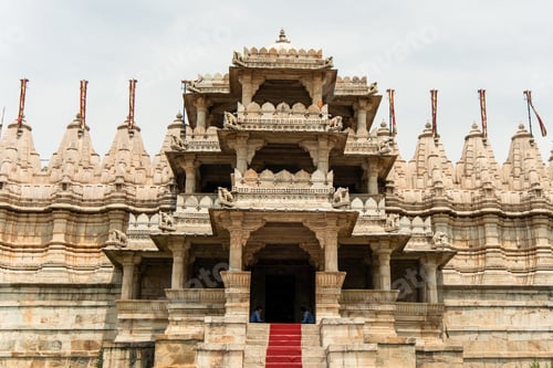 Preview: Chaumukha Temple showing intricate carvings and red carpet in Ranakpur, India