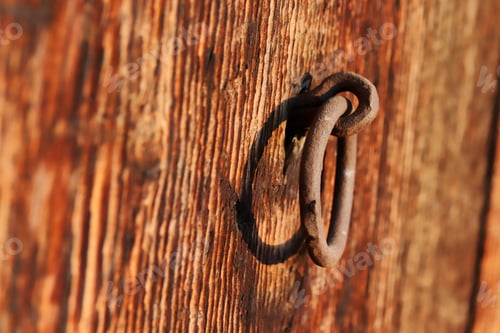 Preview: Rusty Metal Ring on Weathered Wooden Plank