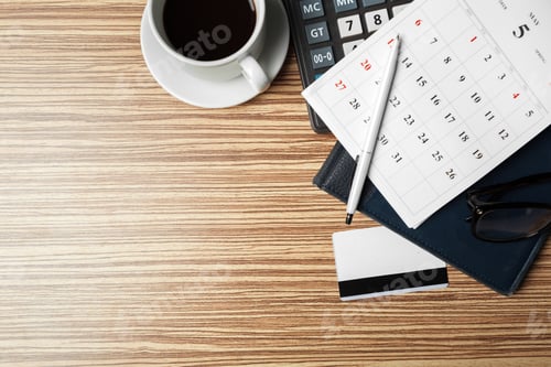 Preview: Work desk setup with coffee, calendar, and business tools during the day