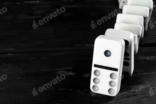 Preview: Domino game. Dominoes on a black table
