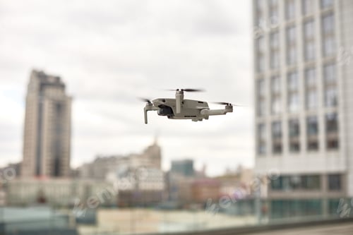 Preview: drone fly in city center. exploring new building with innovative technology taking aerial photos