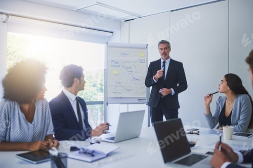 Preview: Shot of a mature businessman giving a presentation to his colleagues in an office