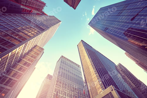 Preview: Vintage stylized photo of Manhattan skyscrapers at sunset, NYC.