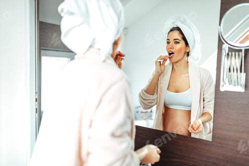 Preview: Woman Brushing Her Teeth in the Bathroom