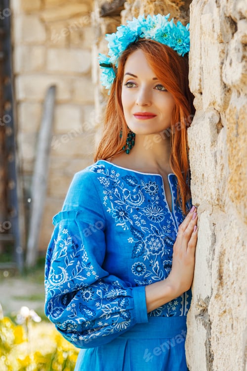 Preview: Beautiful red-haired girl in a blue dress (Ukrainian) with a wreath on her head