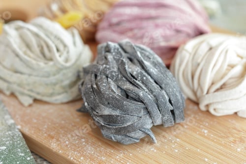 Preview: Making different types of pasta by hand in a kitchen setting on a wooden board