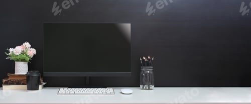 Preview: Computer and various equipment are putting on a white working desk in the comfortable living room.