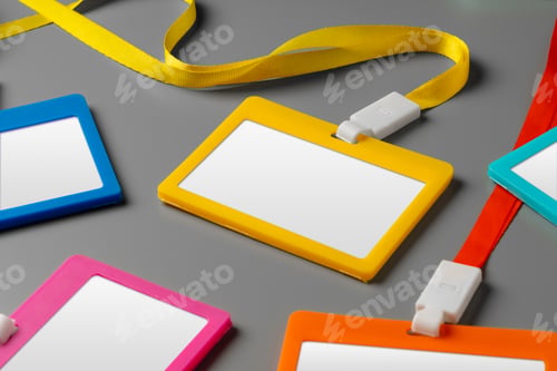 Preview: Colored blank nametags on strings on gray background