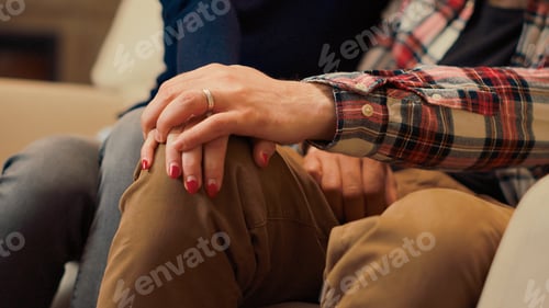 Preview: Married couple holding hands after reconciliation at couple therapy session