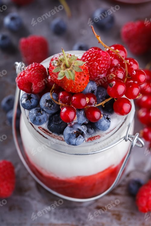 Preview: Yogurt,homemade,with fresh berries, berry puree in a glass container.Healthy eating.