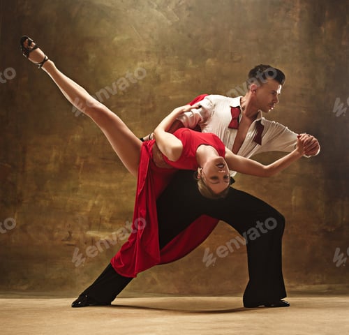 Preview: Flexible young modern dance couple posing in studio.