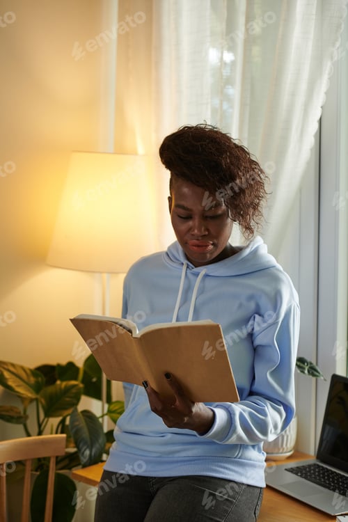 Preview: Woman Reading Book for Work