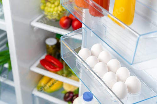 Preview: Pack of eggs on a fridge shelf
